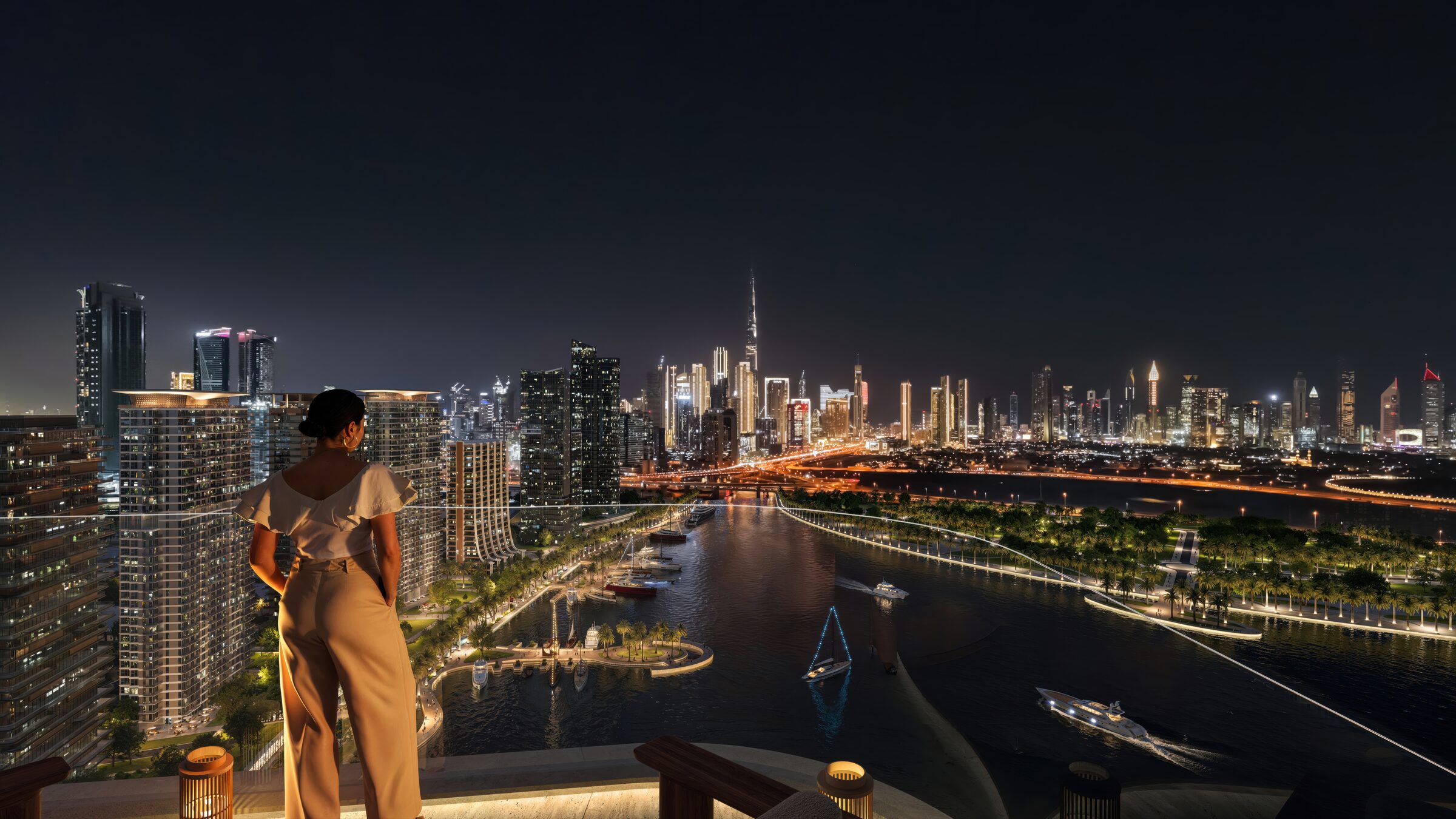 A resident on a private terrace at night, the Burj Khalifa and Downtown skyline glittering across the Canal