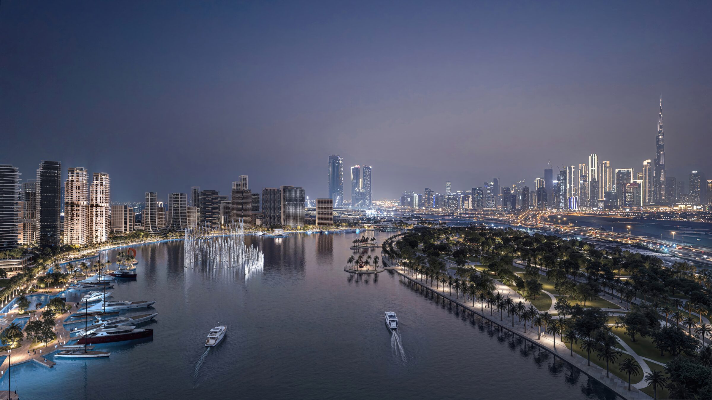 The waterfront district at night — marina, dancing fountains, palm-lined promenade and the Downtown skyline beyond