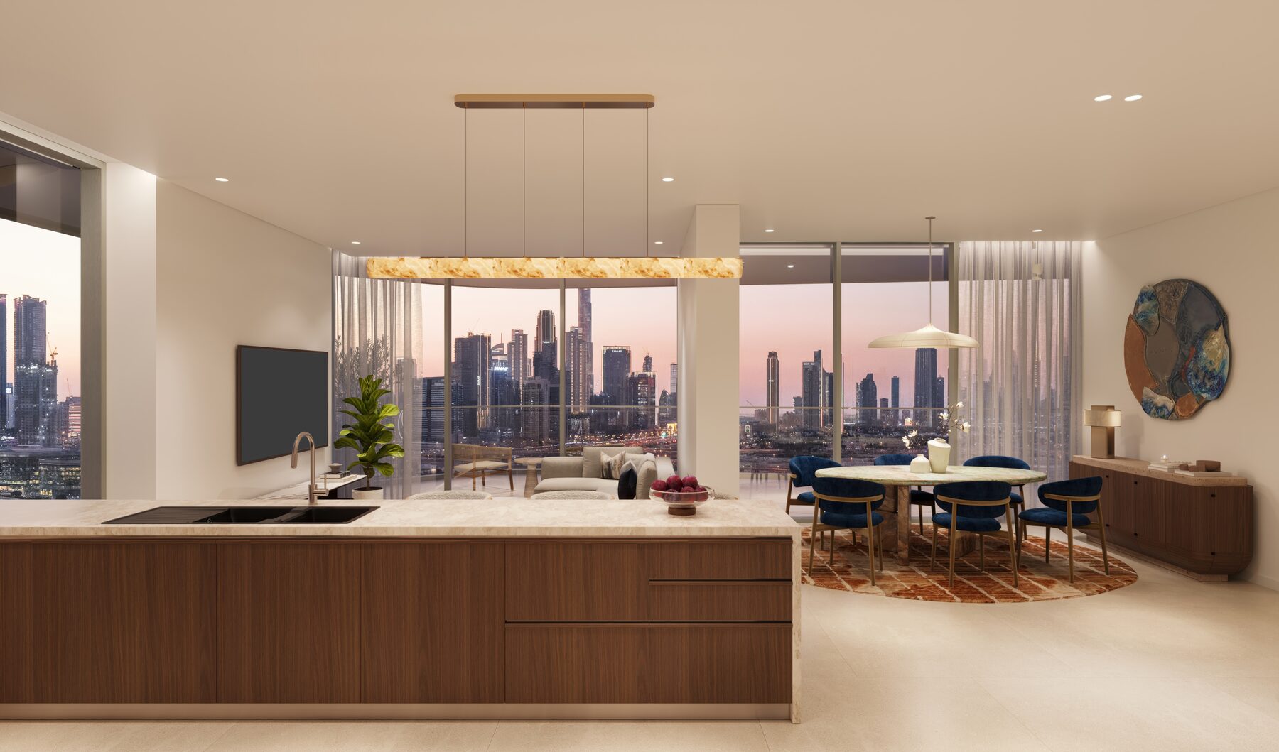 Island kitchen in walnut and stone opening to a dining area and terrace with skyline views