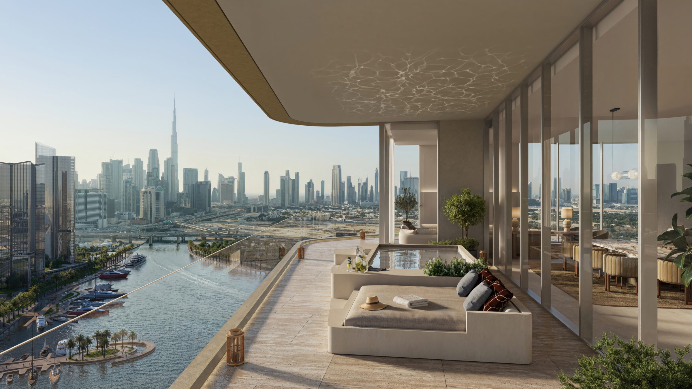 Expansive penthouse terrace with daybeds and a plunge pool, the Downtown skyline stretching along the Canal