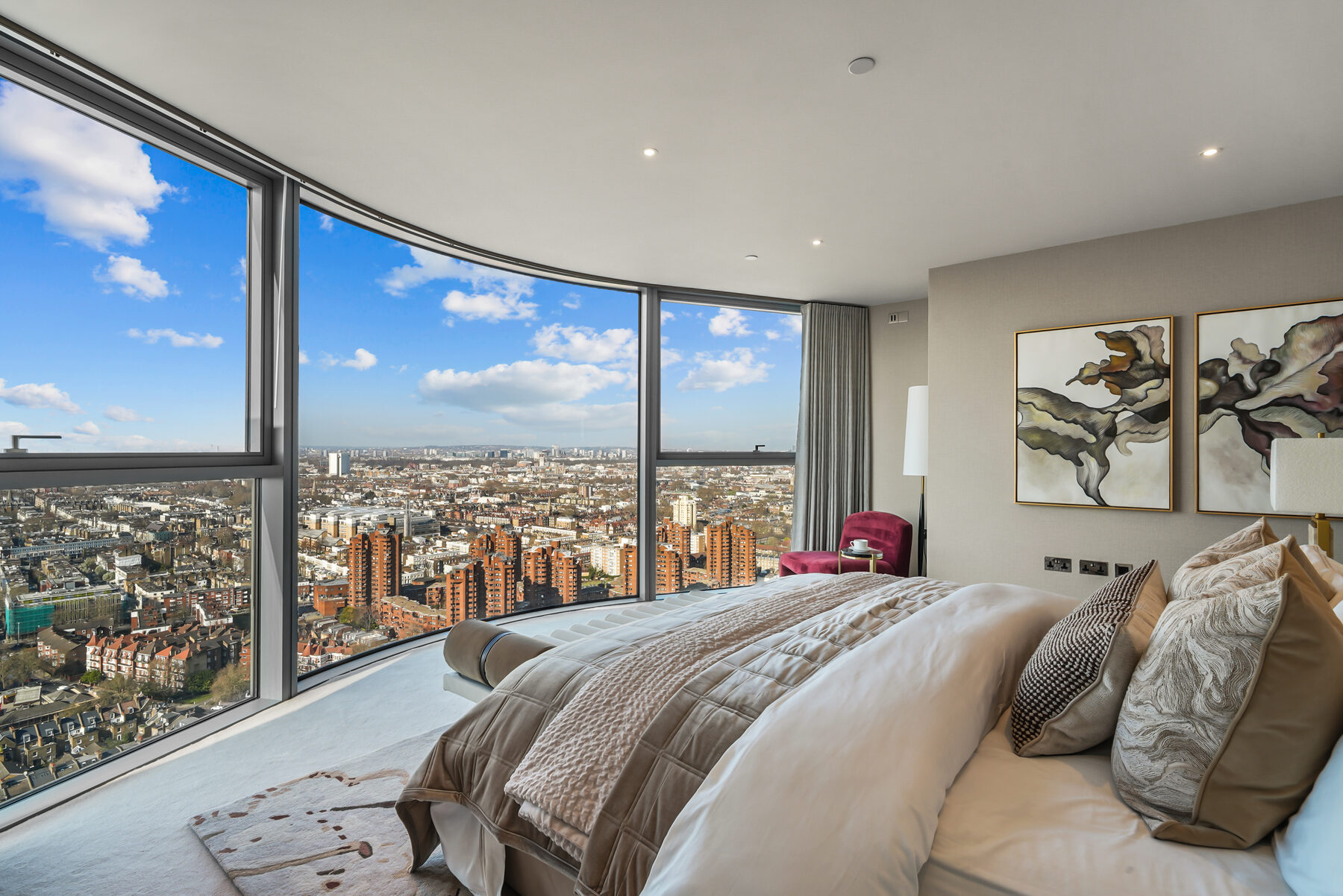 Principal bedroom following the curve of the tower, city views beyond