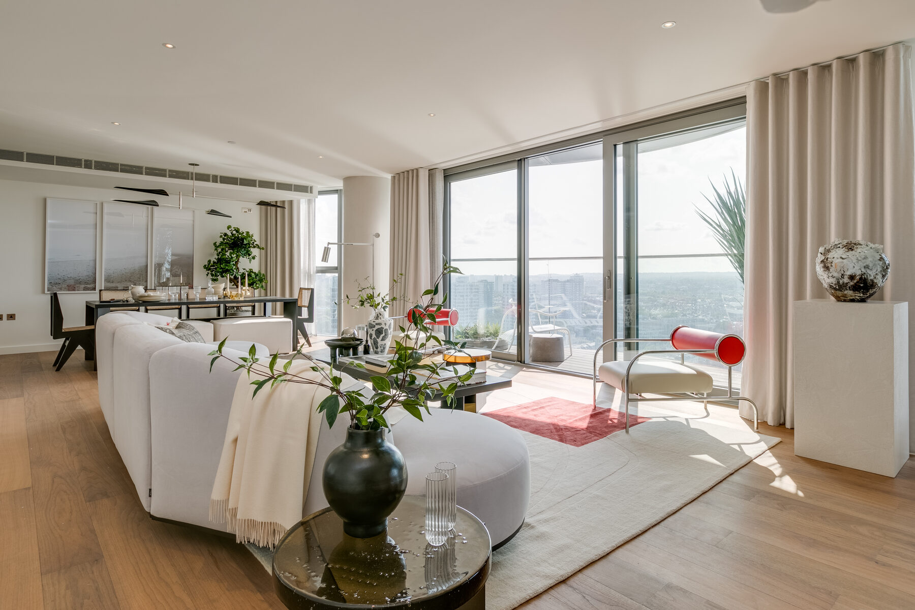 Living room styled with contemporary furniture and terrace access